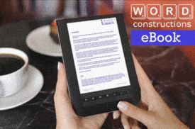 hands holding an electronic reader to view a writing skills eBook from Word Constructions